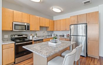 Fitted Kitchen With Island Dining at Harbor at Twin Lakes 55+ Apartments, Minnesota